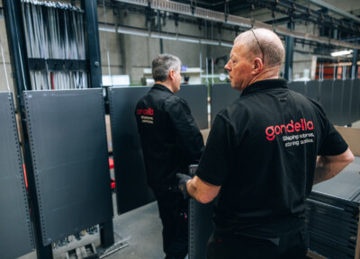 Gondella technicians installing Pitch shelving system in retail environment