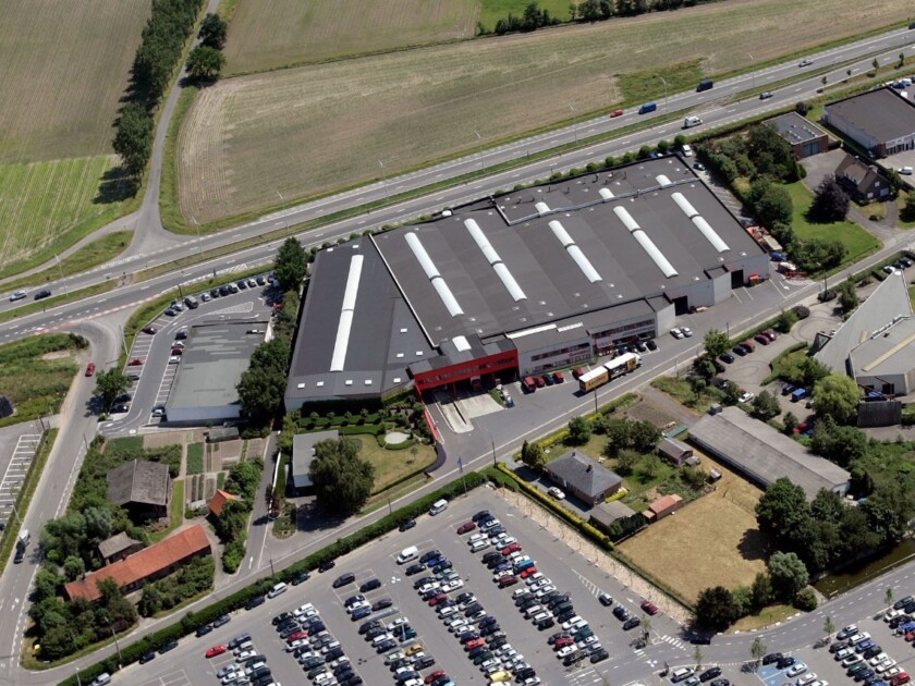 Gondella manufacturing facility and warehouse with loading dock, parking area, and adjacent highway