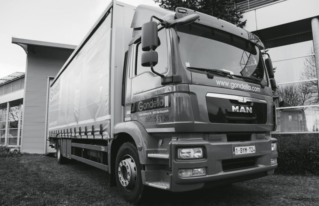 Gondella MAN delivery truck with branded cargo box parked at logistics facility