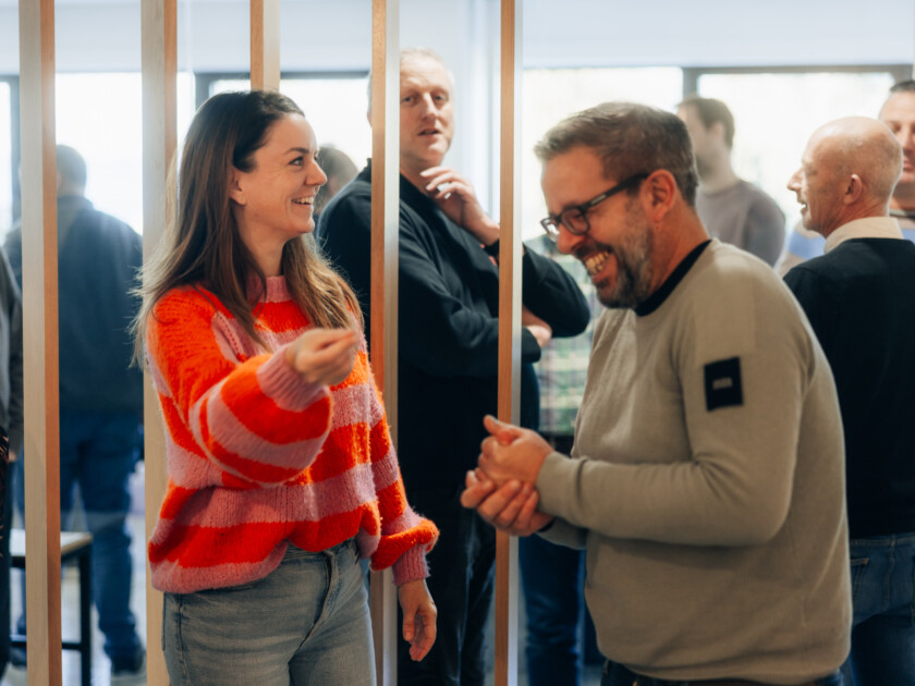Team collaboration meeting in modern office space with large windows
