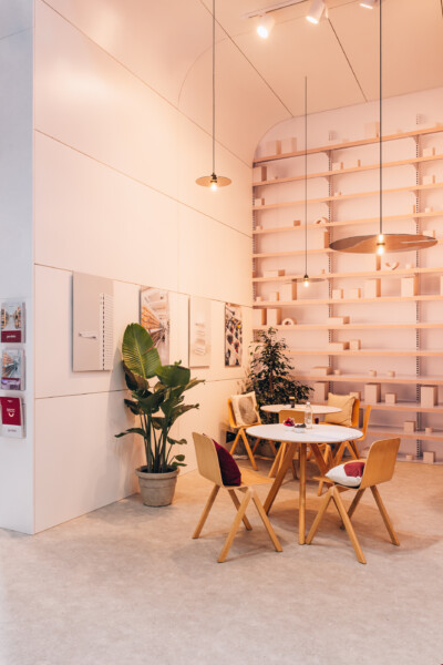 Pitch 25 shelving display with wooden dining furniture and pendant lighting at Euroshop 2023