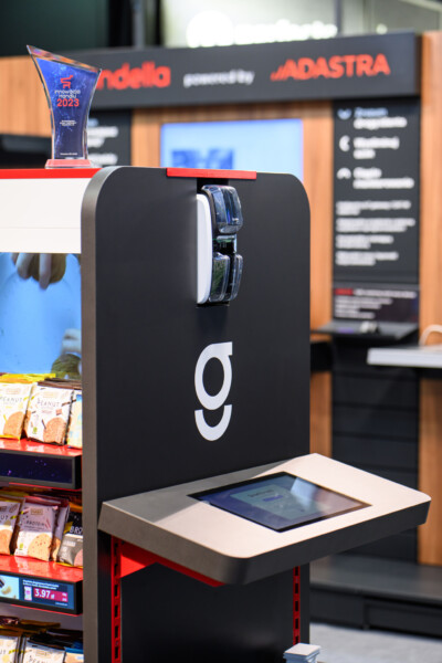 Innovative self-checkout kiosk with digital display and card reader at retail trade show