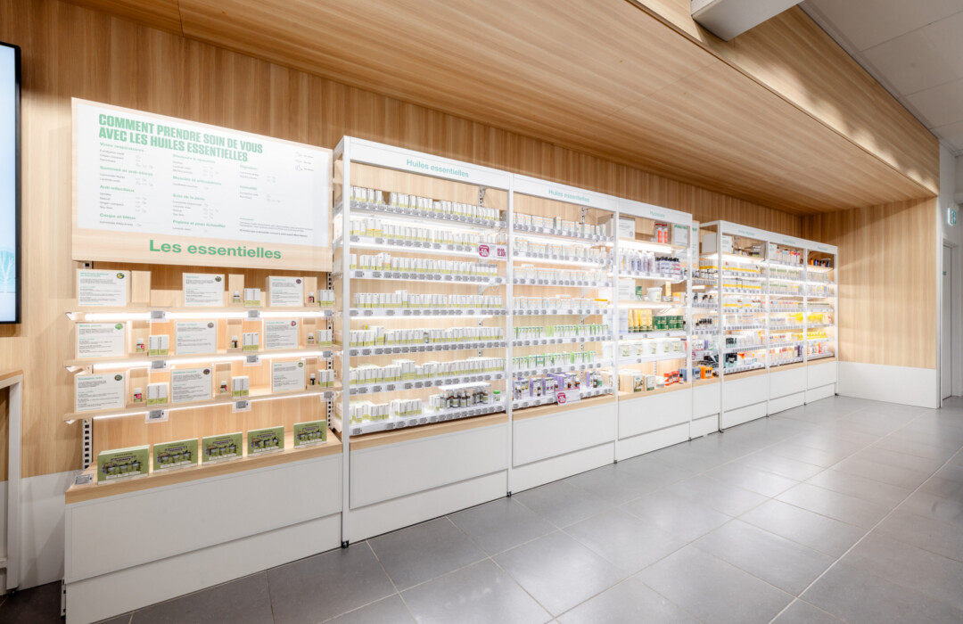 Pitch 25 shelving with essential oils display in health & beauty retail environment, wooden backing with product information signage