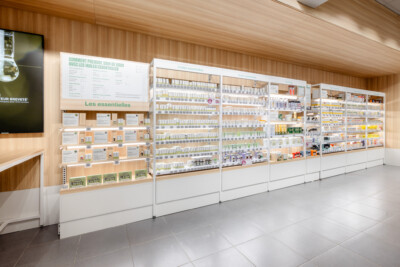 Medi-Market health and beauty retail display with Pitch 41 shelving system, white base units, wooden back panels, and essential oils products organized across multiple shelves