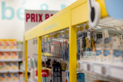 Pitch 25 shelving with yellow end-cap display in Medi-Market pharmacy retail environment