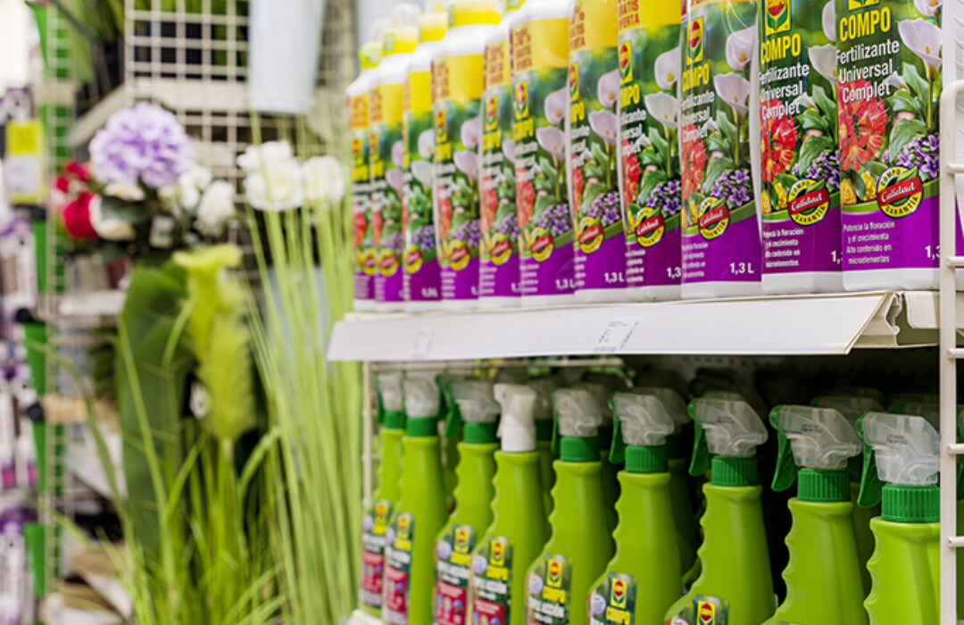 Garden care products on Pitch 25 shelving in garden-pets retail section, yellow and green bottles with promotional signage