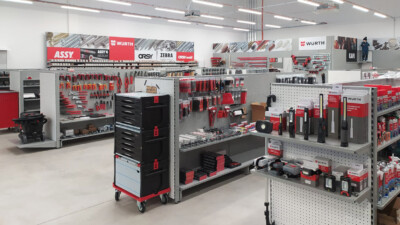 Würth retail display with red and black tool storage, pegboard shelving, and product racks in DIY/industrial sector