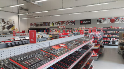Würth tools and supplies retail store interior with red Pitch shelving displaying hand tools, fasteners, and maintenance products across multiple gondolas