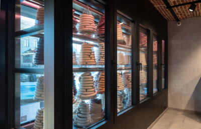 Gondella custom refrigerated display case with stacked bagels and pastries, specialty food retail installation