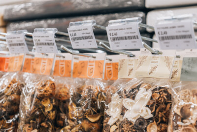 Packaged vanilla pot pourri products with price labels on retail shelf display