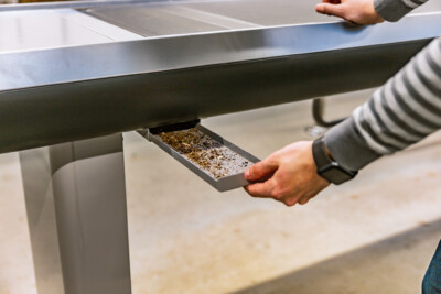 Gondella checkout counter drawer with cash tray being pulled out during retail setup