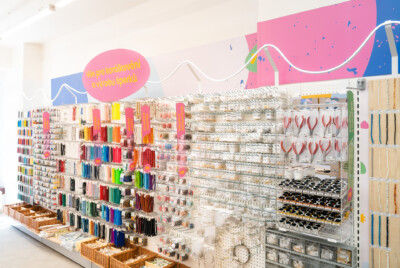 Pitch 25 shelving display with colorful beads, threads, and craft supplies in health & beauty retail setting