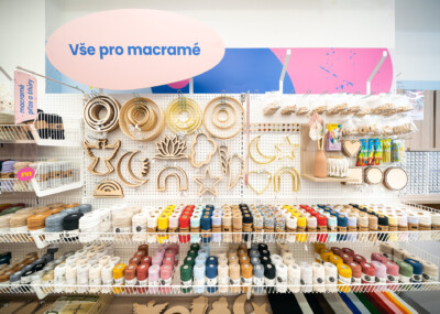 Macramé supply shelf with wooden craft components, colored twine spools, and decorative elements organized on Pitch 25 shelving
