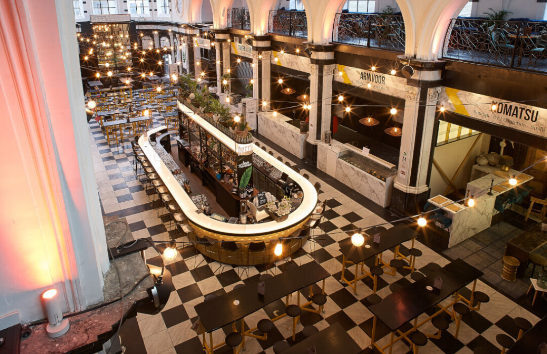 Holy Food Market Ghent interior with custom counters, shelving, and ambient lighting in upscale retail setting