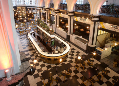 Holy Food Market Ghent interior with custom counters, shelving, and ambient lighting in upscale retail setting