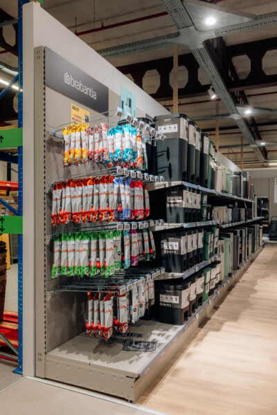 Brabantia Pitch 25 shelving displaying colorful trash bags and black waste bins in retail environment