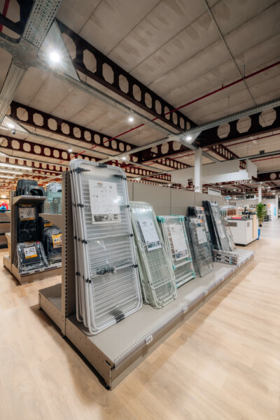 Pitch 25 shelving display with product samples in retail showroom