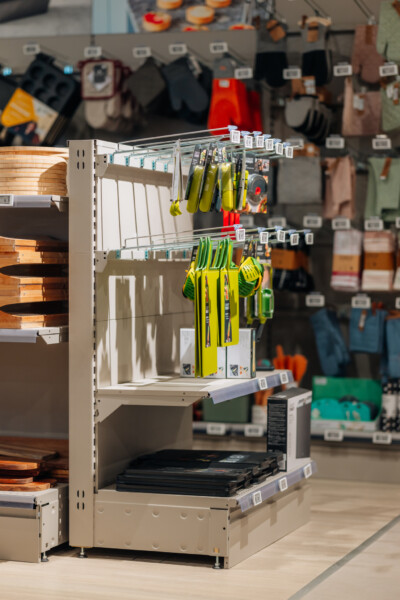 Pitch 25 shelving display with yellow and green safety gloves and work equipment in retail showroom