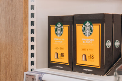 Starbucks Blonde Espresso Roast Nespresso capsules displayed on retail shelving