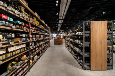 Pitch 25 shelving with beer and beverage products in specialty food retail environment
