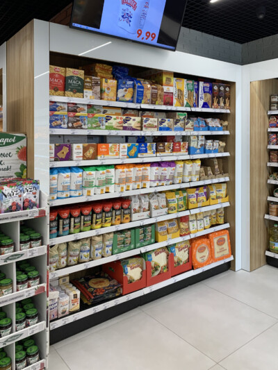 Specialty food shelving display with packaged goods, pasta, and tortillas in Metro supermarket