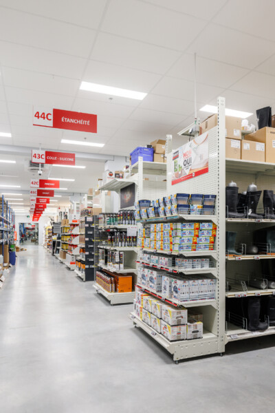 Pitch 25 shelving with packaged products in supermarket aisle, numbered section markers visible