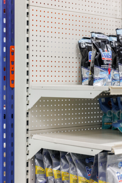 Pitch 25 pegboard shelving with product displays in retail store