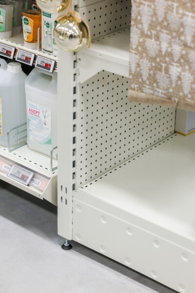 Pitch 25 shelving with perforated backing in supermarket setting, displaying cleaning products and retail displays