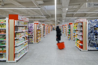 Le Bon supermarket aisle with Pitch shelving displaying groceries and household products