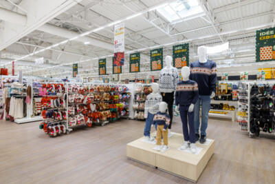 Auchan Troyes supermarket with Pitch shelving displaying seasonal gifts, clothing mannequins, and retail fixtures