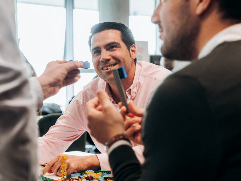 Team members collaborating during a meeting or strategy session in an office environment